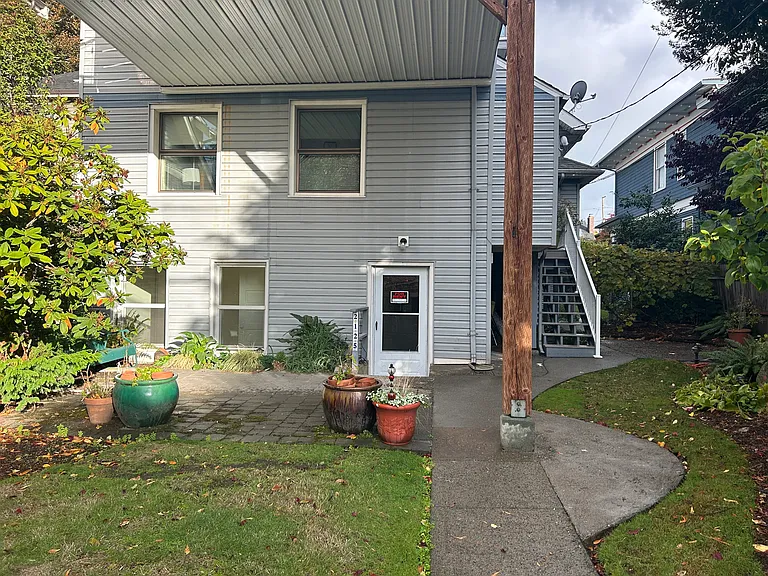 Entrance to Unit # 1 from back yard. Parking spot off to the right in back.