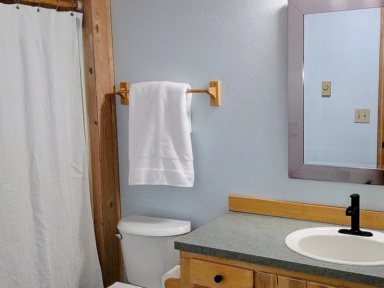 First full bathroom with vaulted ceilings.
