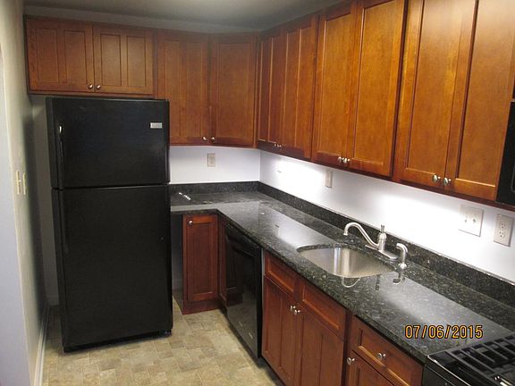 Kitchen granite counters dishwasher fridge 36" cabinets