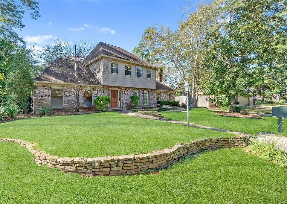 Look at that front yard! The backyard is even better... note the mature trees and plenty of windows to provide a light and bright interior.