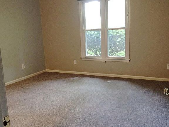 Master Bedroom that measures 13'6" x 13'11'