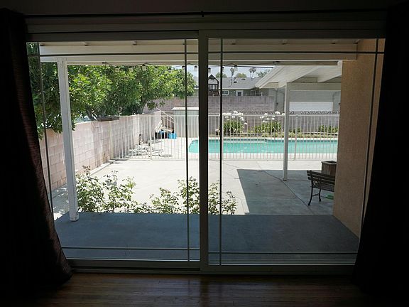 Slider in living room, facing pool