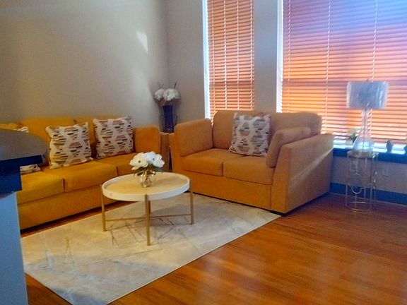 Open living area with large windows and plenty of natural light