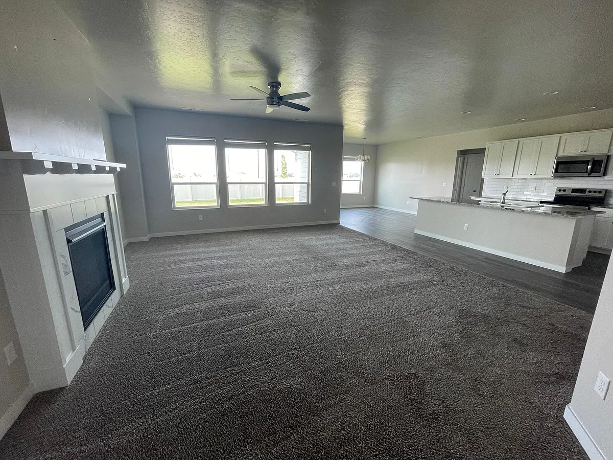 Big open concept living room w/ gas fireplace. All blinds are cordless. - 4673 S Palatino Ave