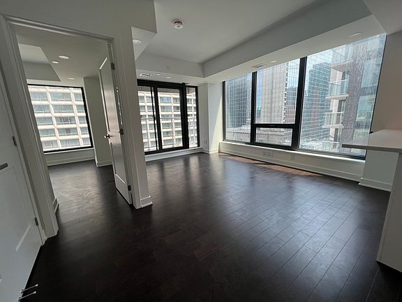 Living room and entrance to bedroom.