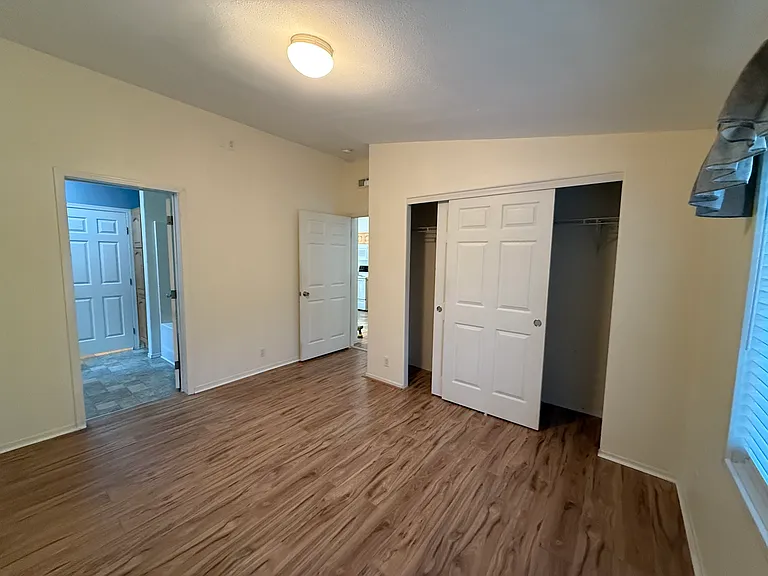 Master bedroom with vaulted ceilings and large closet