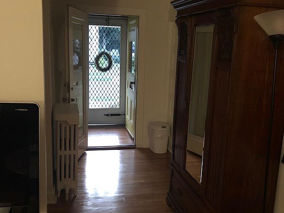 This piece is optional. It's an antique mirrored armoire, closet with hooks and rod with a spacious drawer at the base.