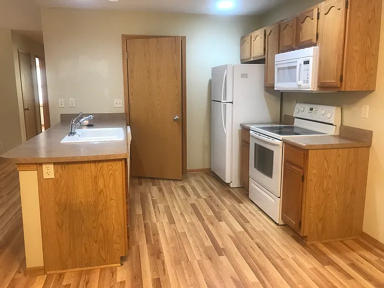 Kitchen includes refrigerator, electric stove, microwave and dishwasher. The closet at the back can serve as a pantry and houses the washer/dryer.
There is a large dining area off of the kitchen (not pictured).