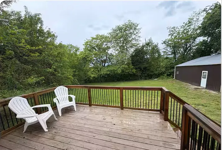 Private deck overlooking fenced backyard