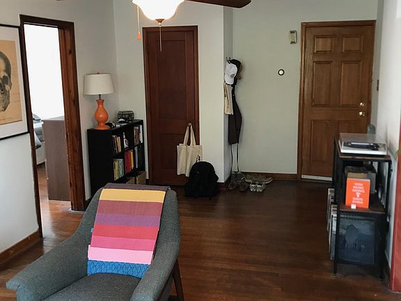 Living room looking at entrance door, closet to left