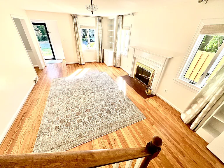 Living Room, looking toward front of house. Brand new carpet to remain, (or we can remove it for you!)