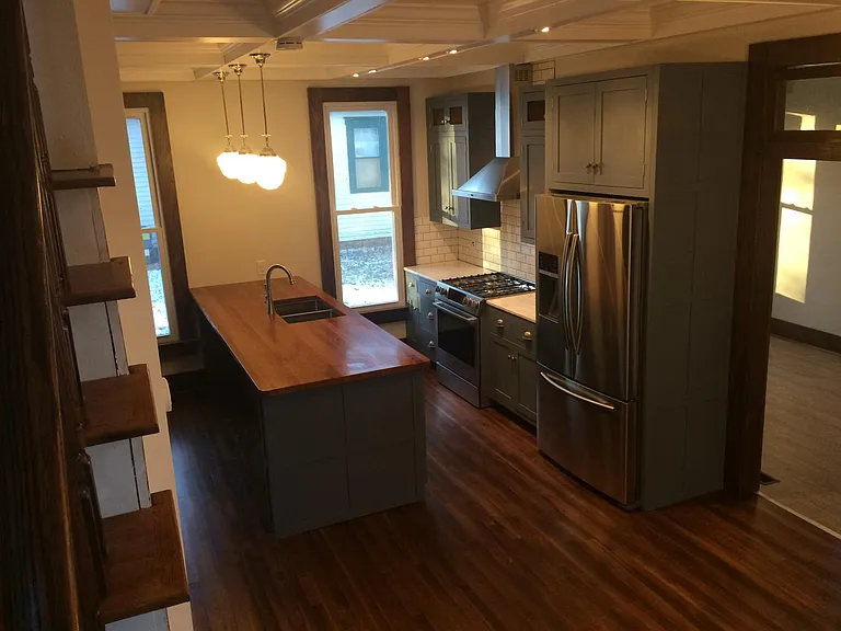 looking at the kitchen from the stairs going to second story