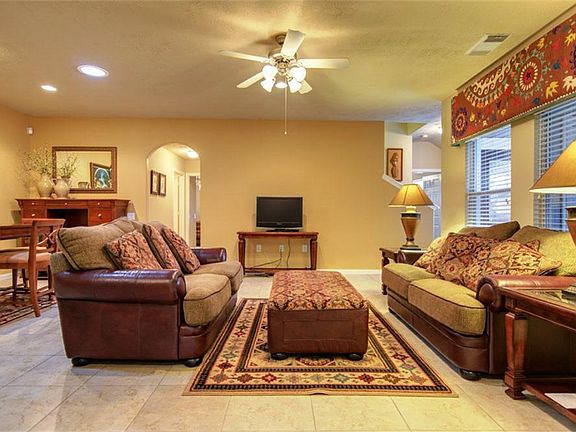 The family room/den is open. The back wall is definitely big enough for a wall unit or flat screen T