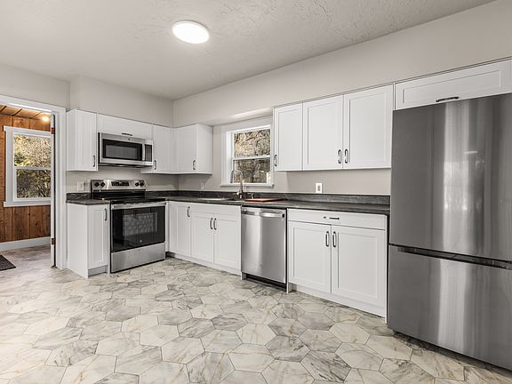 BRAND NEW KITCHEN - new flooring, paint, lighting, cabinets, appliances and countertops.