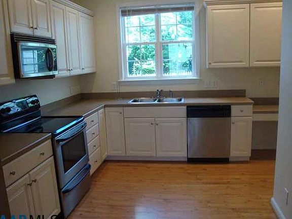 Kitchen with pantry and backyard view.