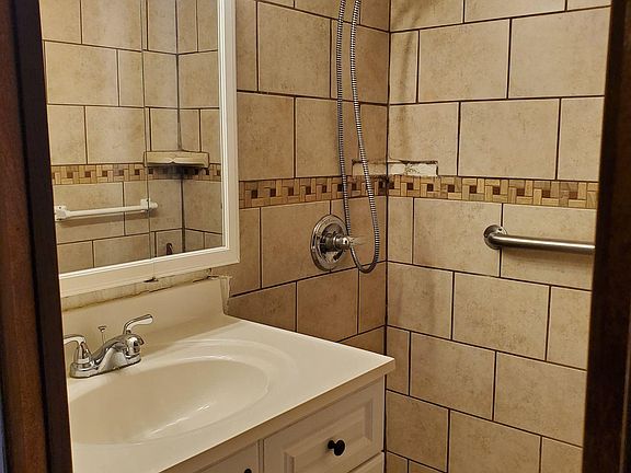Bathroom tiled shower.