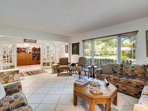 Livingroom with its wide & high window to allow natural light in!