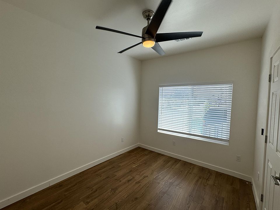 First Bedroom with Ceiling Fan on Remote.