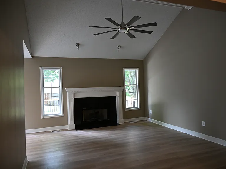 Living room. Fireplace with black granite insert.