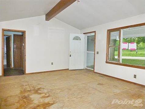 Check out the very large living room with wood beam. Very nice!
