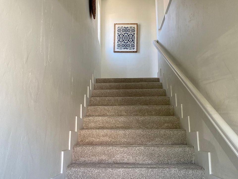 Private entrance with indoor stairway.