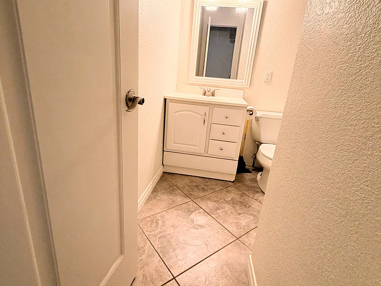 Hallway bathroom. Full tub