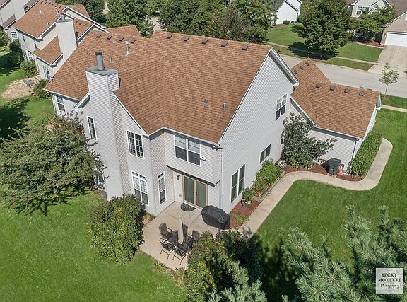 Loads of Side Yard Leads You Around back to Charming Landscaped Yard and Patio.