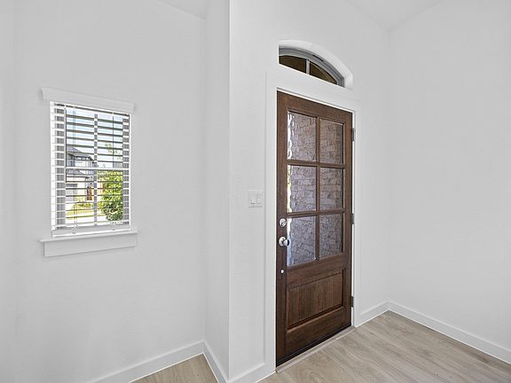 Entry in the Pecan II home plan by Trophy Signature Homes - REPRESENTATIVE PHOTO