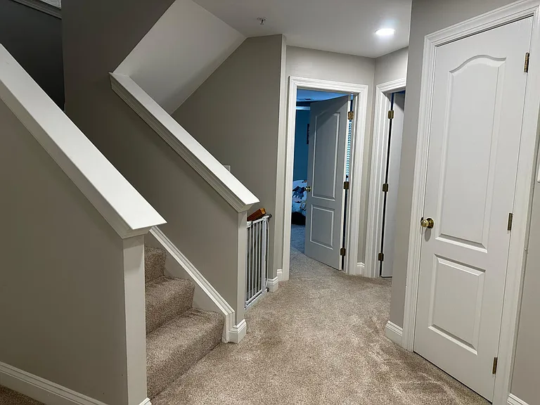 Second floor contains two guest bedrooms, den, one full bathroom,