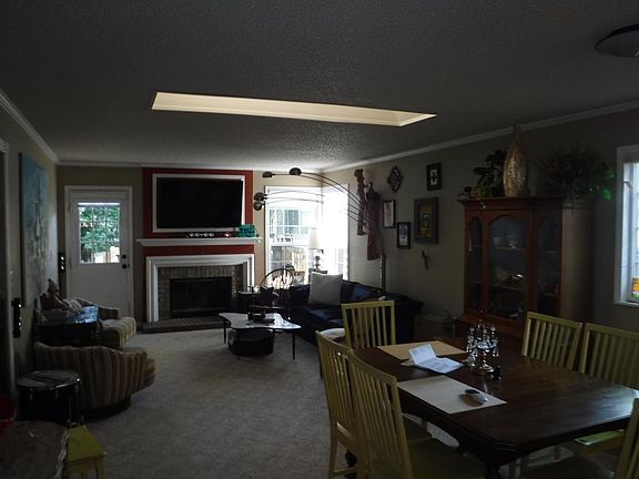 Living and Dining Area with Gas Fireplace in Ideal Spot for