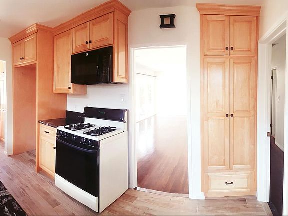 Kitchen Access to Living Room and Hallway