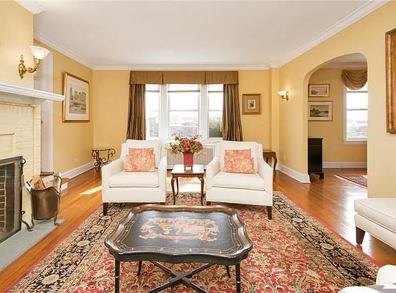 Crown moldings and gleaming hard wood floors can be seen throughout this bright unit.
