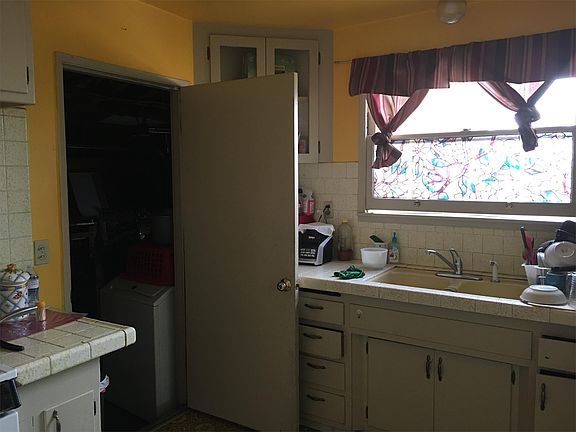To garage (with laundry hook ups) and additional pantry spac