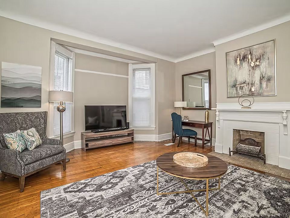 Beautiful living room in this gracious fully renovated home with newer windows, hvac, etc. Fireplace has been disconnected.