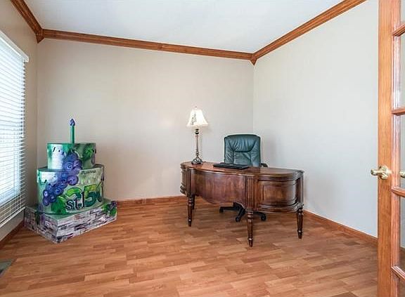 This den is perfect for your home office. Crown molding and french doors make it a cozy work space.