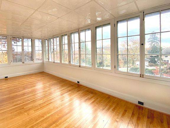 Sunroom with sunrise/sunset and views