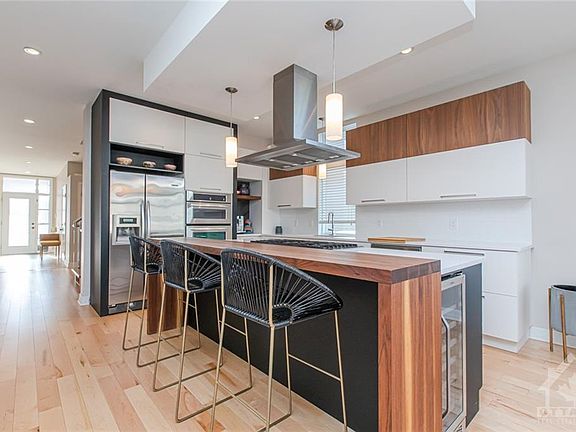 Kitchen island with wine cooler, gas cooktop