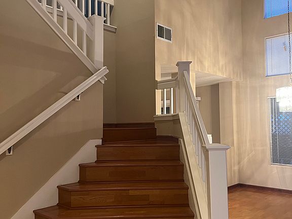 staircase leading to 4 bedrooms upstairs