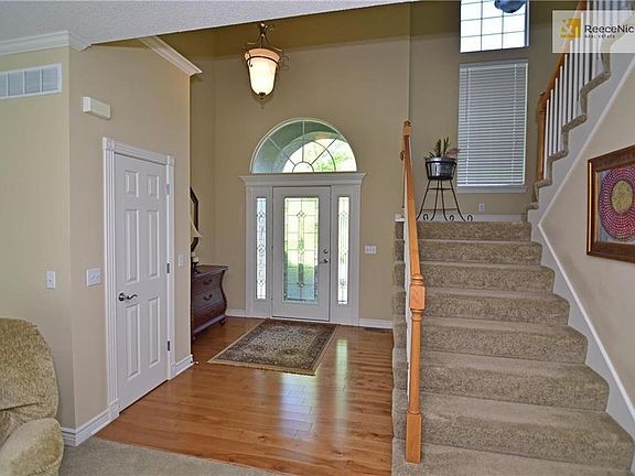 Entry opens into the great room with staircase to second level bedrooms