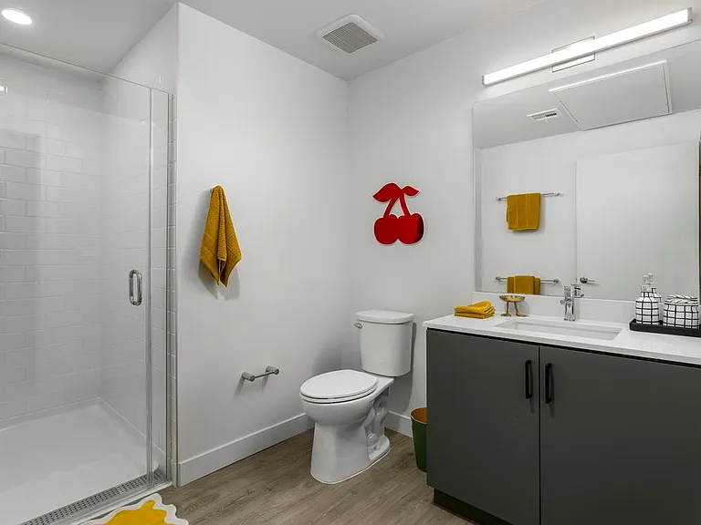 Finish Package II Bath with grey cabinetry, white quartz countertop, and hard-surface flooring