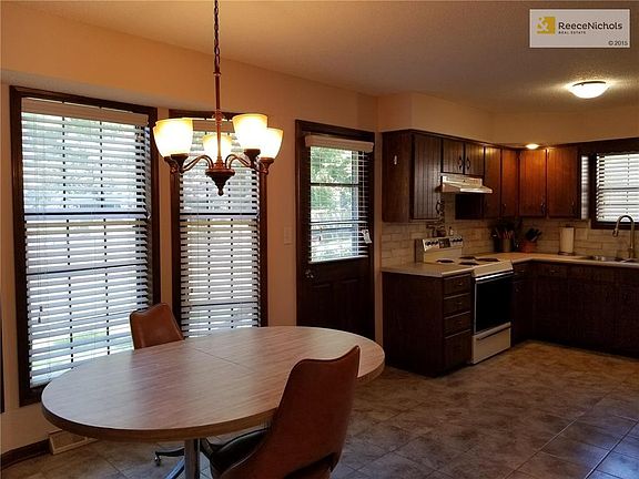 New countertops, backsplash, tiled floors.  Refrigerator stays