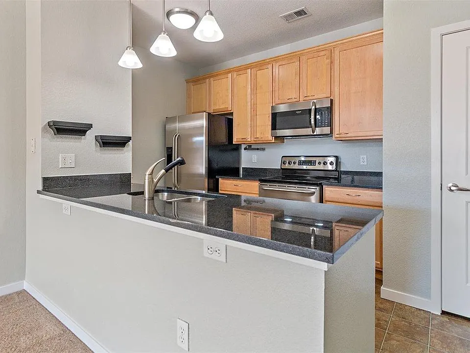 Stainless steel appliances and granite counters