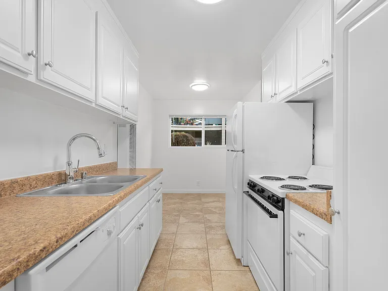 KITCHEN - Angle #1
* This is a typical apartment. Some features may vary from apartment to apartment such as the counter tops and tile colors, etc. but most will be nutral colors.