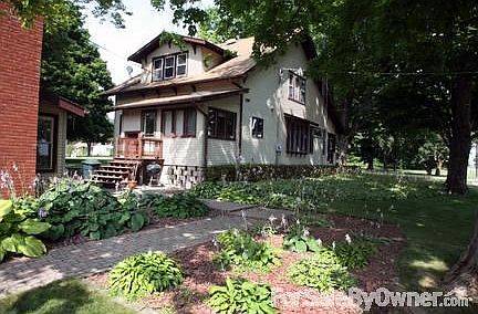 Rear entrance of home
						:
						Landscaped with a variety of hostas. Quiet neighborhood and welcoming neighbors.