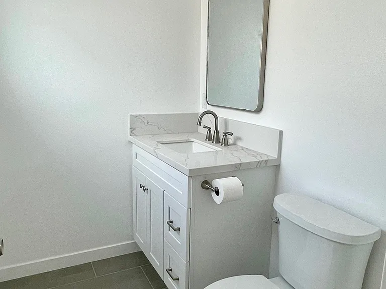 Half bathroom located in first level / rear unit