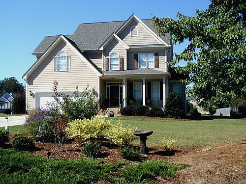 Immaculate home on lushly landscaped lot 