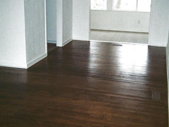 Dining room looking into the den and a doorway into the kitc