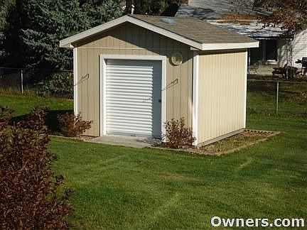 Large yard, deck, shed and mature trees