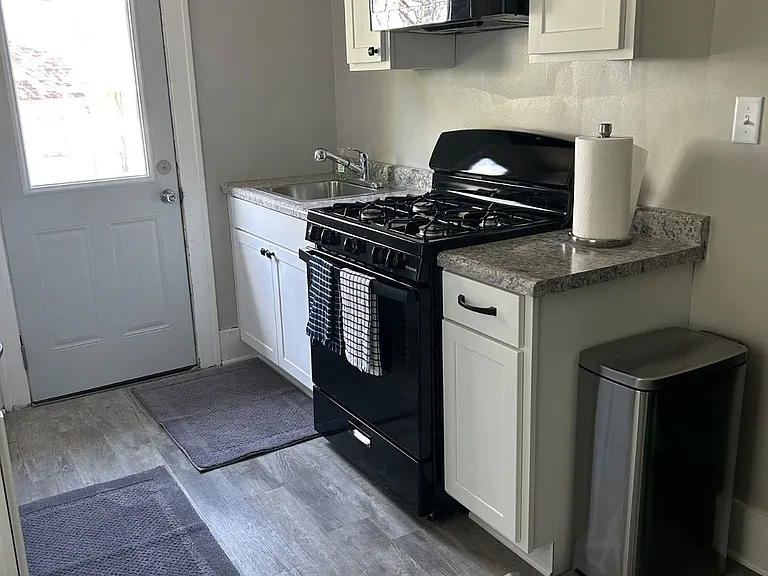 New stove/ oven, microwave for all your cooking needs. Door leads to a small patio that can be used if you would like.