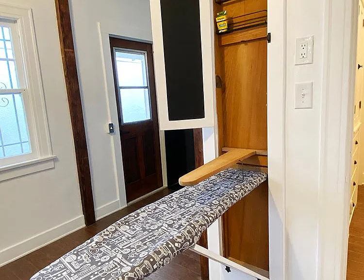 Original 1920 ironing board (hidden in cabinet) + chalkboard